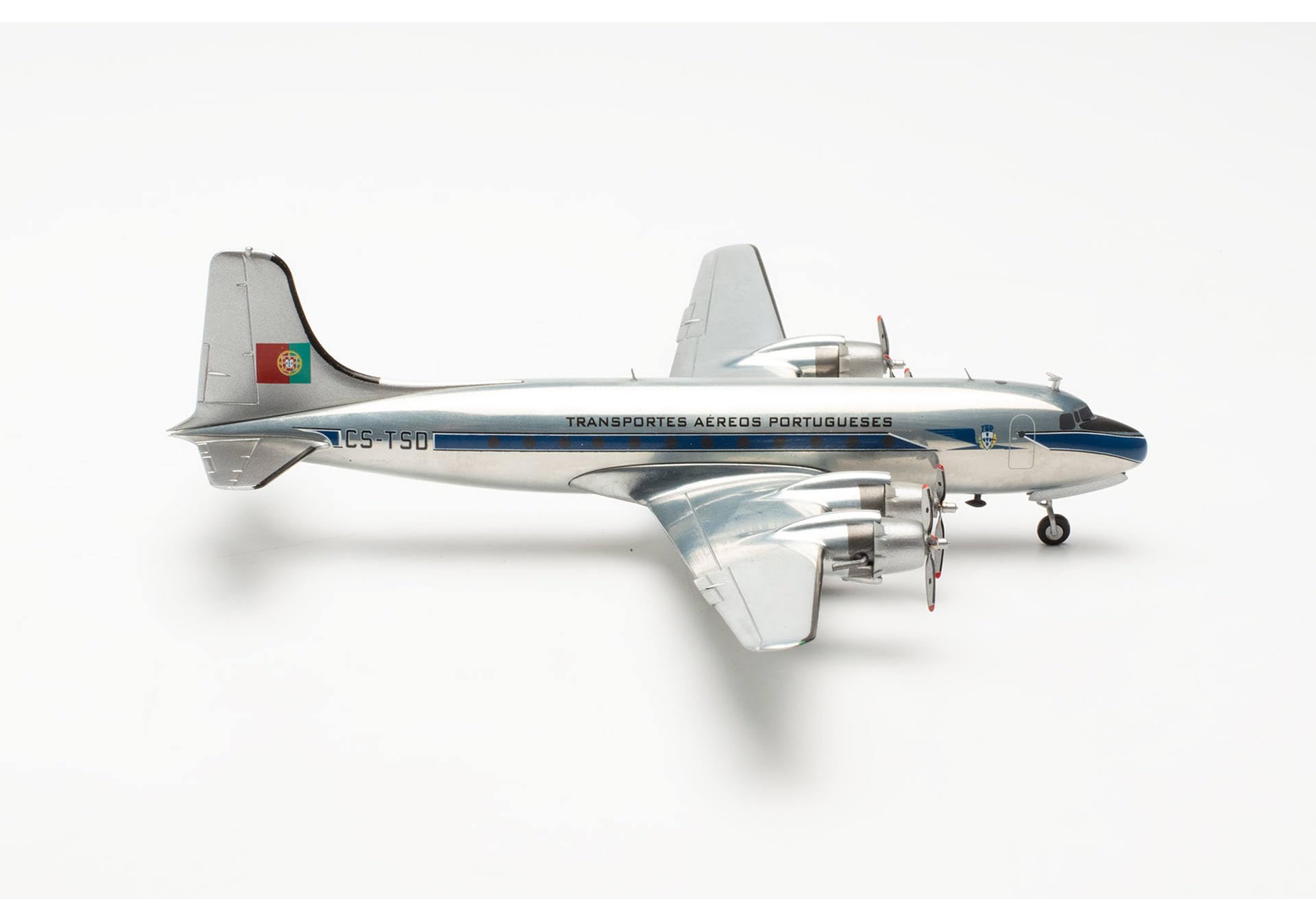 herpa-wings-tap-dc-4-cs-tsd-flugzeugmodell-1-200-mit-standfu image 1