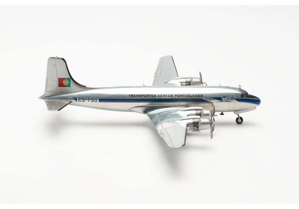 herpa-wings-tap-dc-4-cs-tsd-flugzeugmodell-1-200-mit-standfu image 1