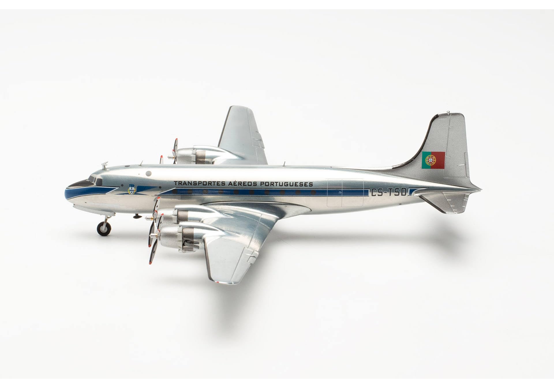 herpa-wings-tap-dc-4-cs-tsd-flugzeugmodell-1-200-mit-standfu image 2